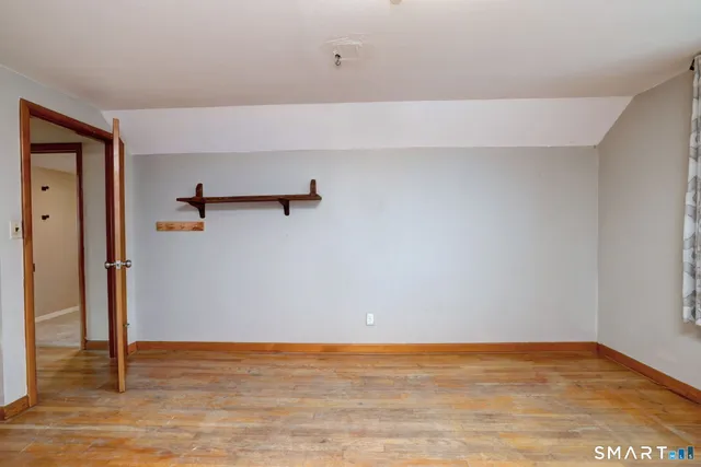 a bathroom with a sink toilet and mirror