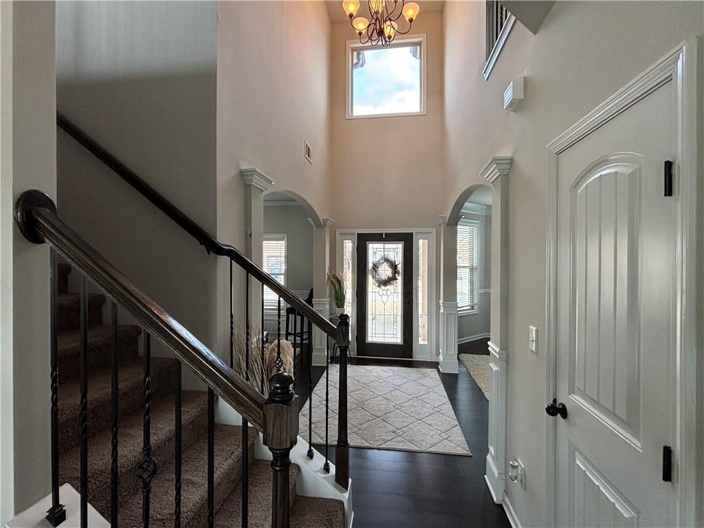 3459 In Bloom Way Auburn, GA 30011 - Photo 16 of 35 a view of a hallway with wooden floor and staircase