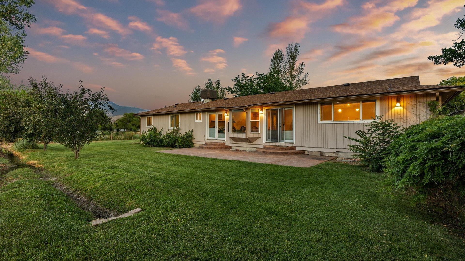 3482 F Road Clifton, CO 81520 - Photo 29 of 30 a backyard of a house with lots of green space and garden