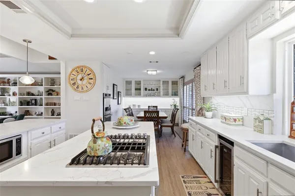a large kitchen with lots of counter space and window