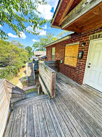 a view of deck with wooden floor and outdoor seating