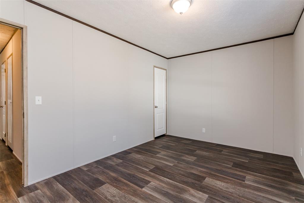 2900 Interstate 35, Unit 197 Waco, TX 76706 - Photo 18 of 24 a view of a small space with wooden floor and a window