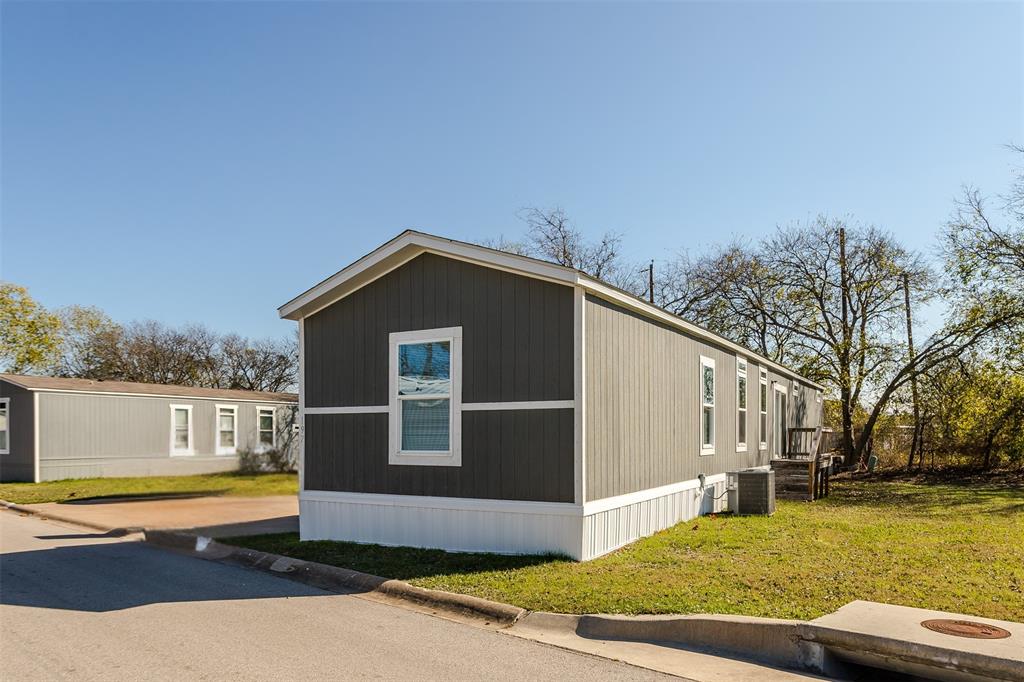 2900 Interstate 35, Unit 197 Waco, TX 76706 - Photo 23 of 24 a front view of a house with a yard