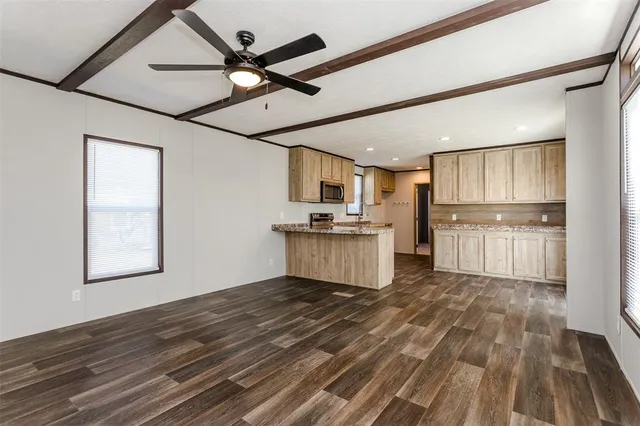 a view of kitchen with wooden floor and window