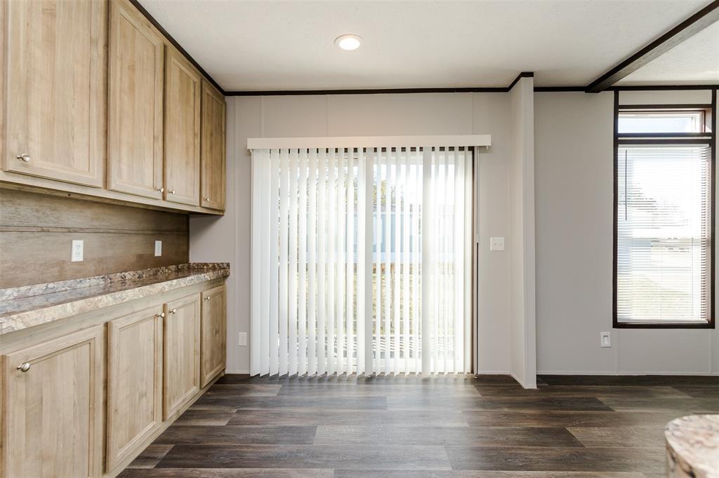 2900 Interstate 35, Unit 197 Waco, TX 76706 - Photo 6 of 24 an empty room with wooden floor and windows