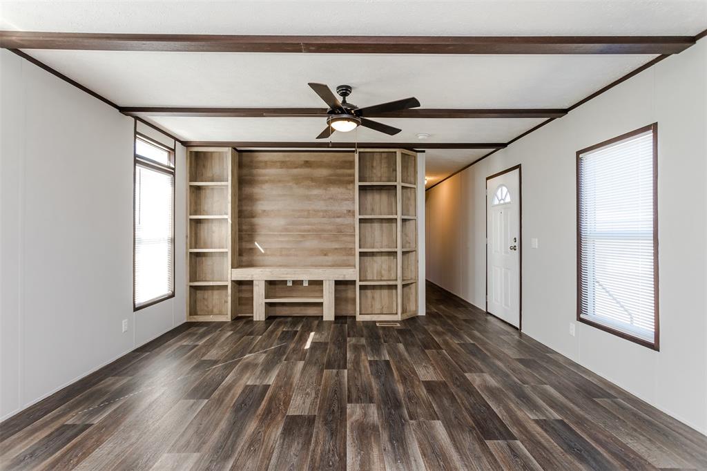 2900 Interstate 35, Unit 197 Waco, TX 76706 - Photo 7 of 24 wooden floor in an empty room with a window