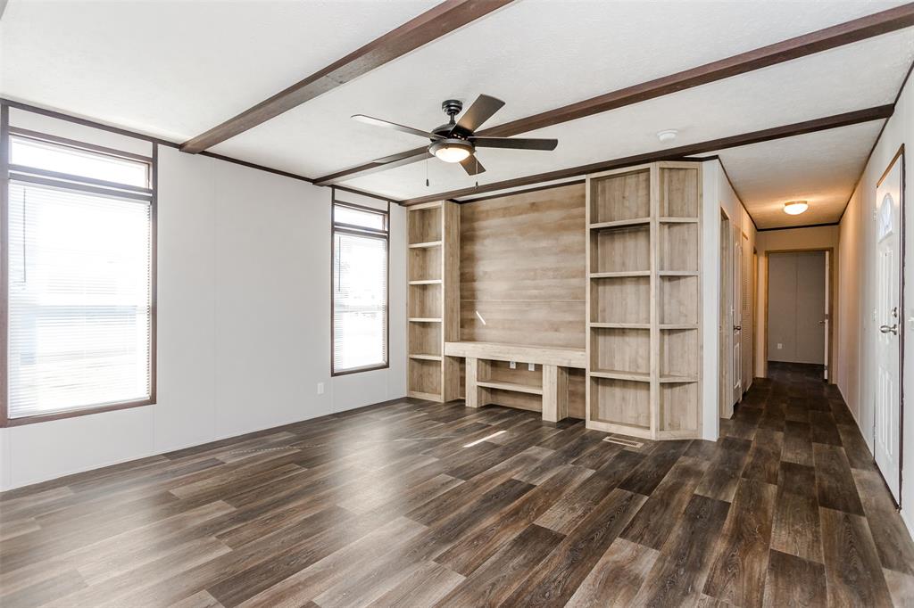 2900 Interstate 35, Unit 197 Waco, TX 76706 - Photo 9 of 24 wooden floor in an empty room with a window