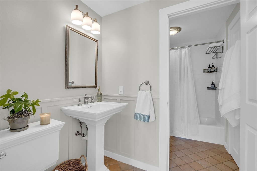 47 Center Bridge Road Lancaster, MA 01523 - Photo 16 of 42 a bathroom with a sink a mirror and a shower