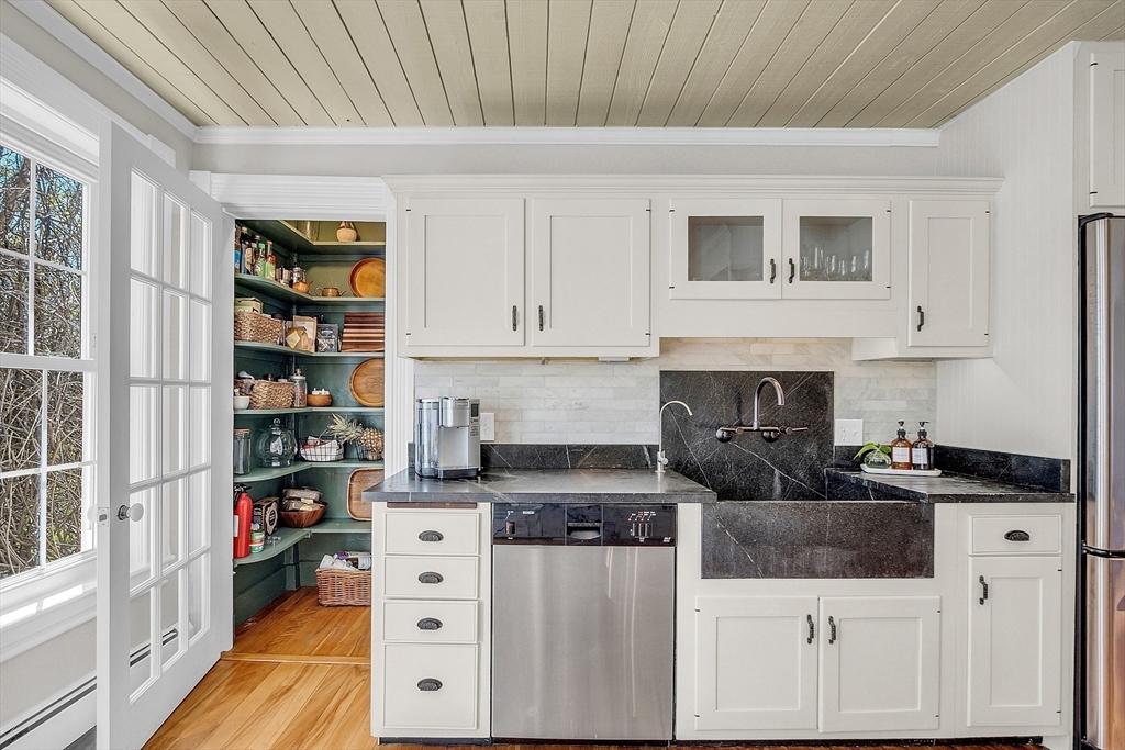 47 Center Bridge Road Lancaster, MA 01523 - Photo 19 of 42 a kitchen with stainless steel appliances granite countertop a stove and a refrigerator
