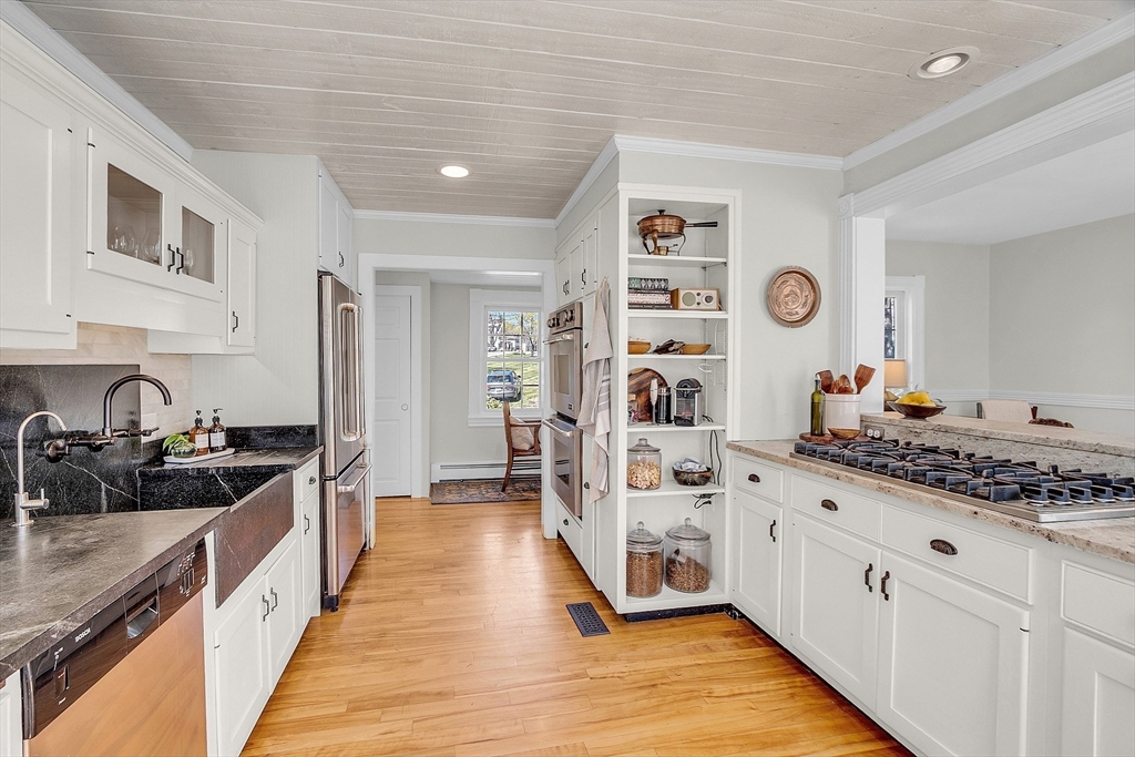 47 Center Bridge Road Lancaster, MA 01523 - Photo 20 of 42 a kitchen with stainless steel appliances a stove a sink and a refrigerator