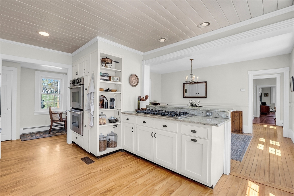 47 Center Bridge Road Lancaster, MA 01523 - Photo 21 of 42 a spacious bathroom with a granite countertop sink and a mirror