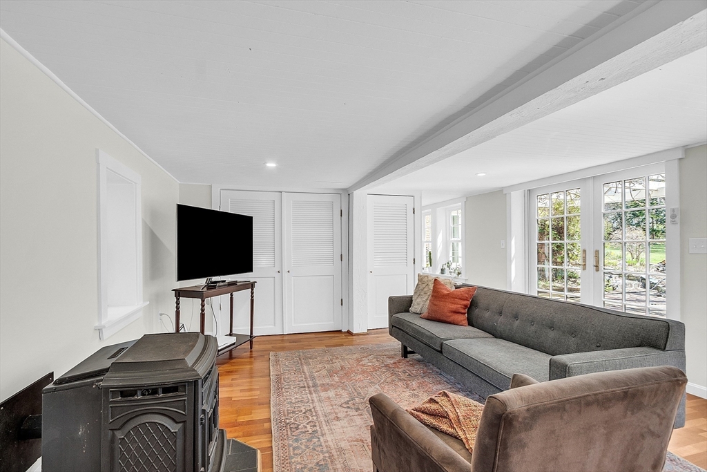 47 Center Bridge Road Lancaster, MA 01523 - Photo 29 of 42 a living room with furniture and a flat screen tv