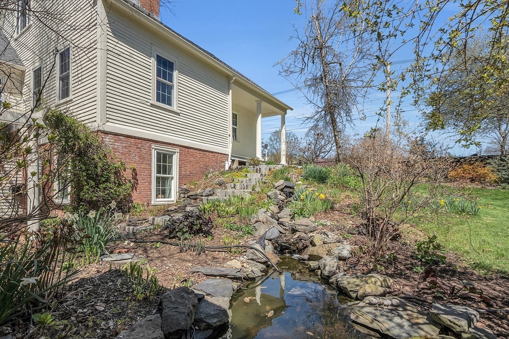 47 Center Bridge Road Lancaster, MA 01523 - Photo 36 of 42 a house that has a lot of plants in it