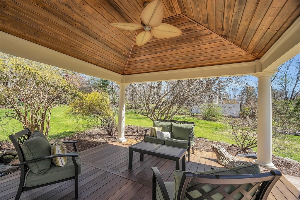 47 Center Bridge Road Lancaster, MA 01523 - Photo 37 of 42 a view of a patio with table and chairs and wooden floor