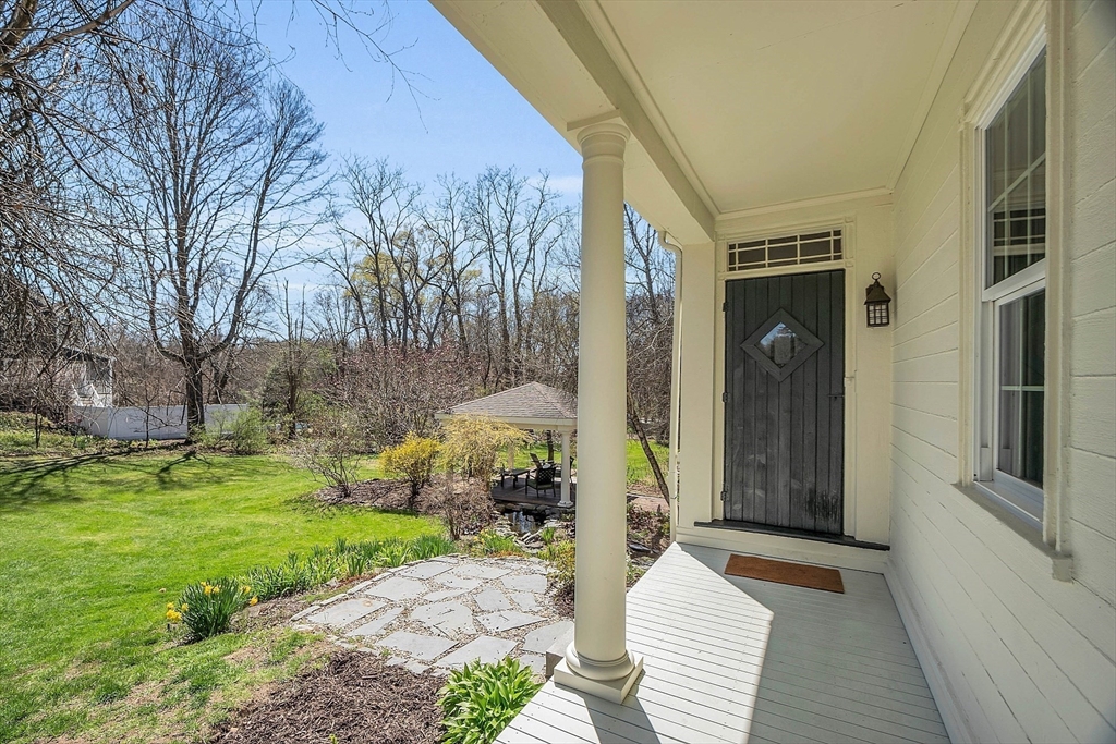 47 Center Bridge Road Lancaster, MA 01523 - Photo 5 of 42 a front view of a house with garden