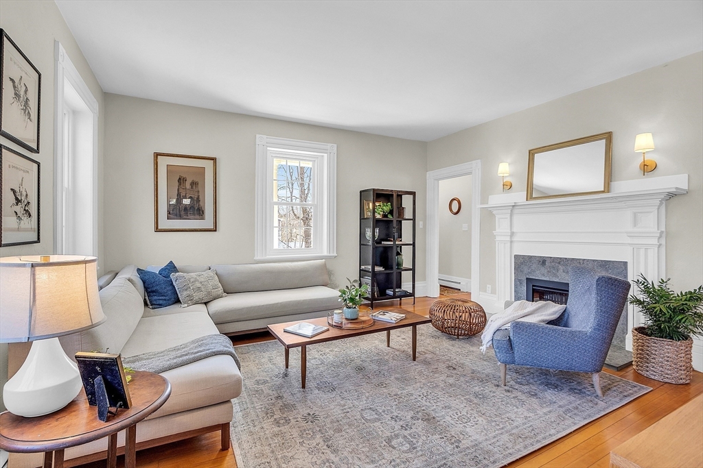 47 Center Bridge Road Lancaster, MA 01523 - Photo 9 of 42 a living room with furniture and a fireplace