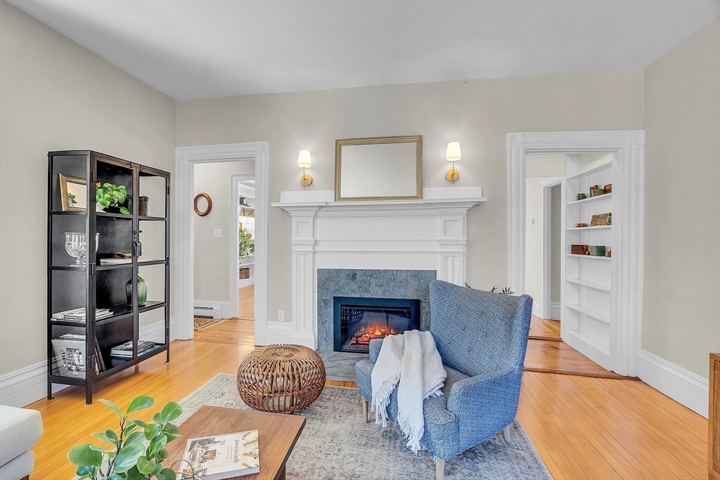 47 Center Bridge Road Lancaster, MA 01523 - Photo 10 of 42 a living room with furniture and a fireplace
