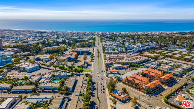 an aerial view of city and lake