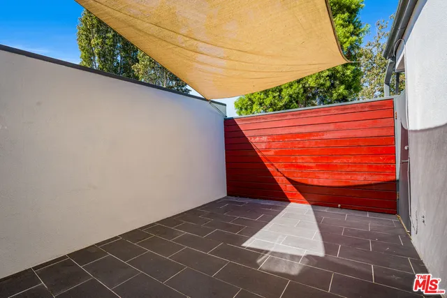 a view of a backyard with sitting area