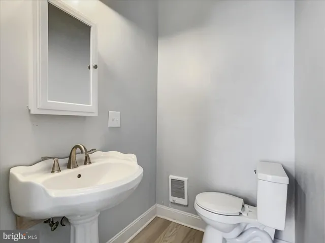 a white sink sitting next to a white sink