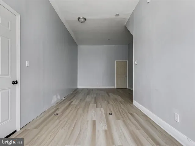 a view of wooden floor in a hallway