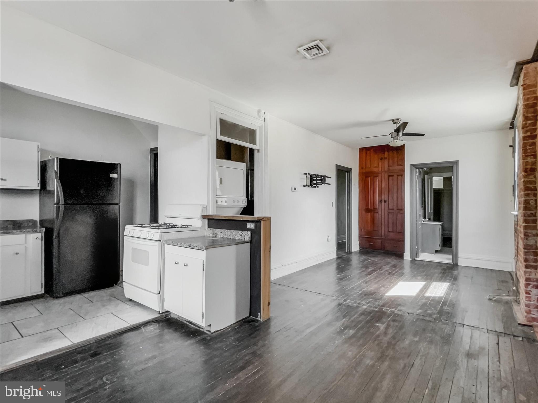 219 South Union Street Middletown, PA 17057 - Photo 6 of 26 a kitchen with stainless steel appliances granite countertop a refrigerator and a stove top oven