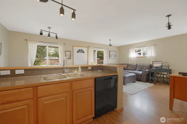 a view of living room with granite countertop furniture and fireplace