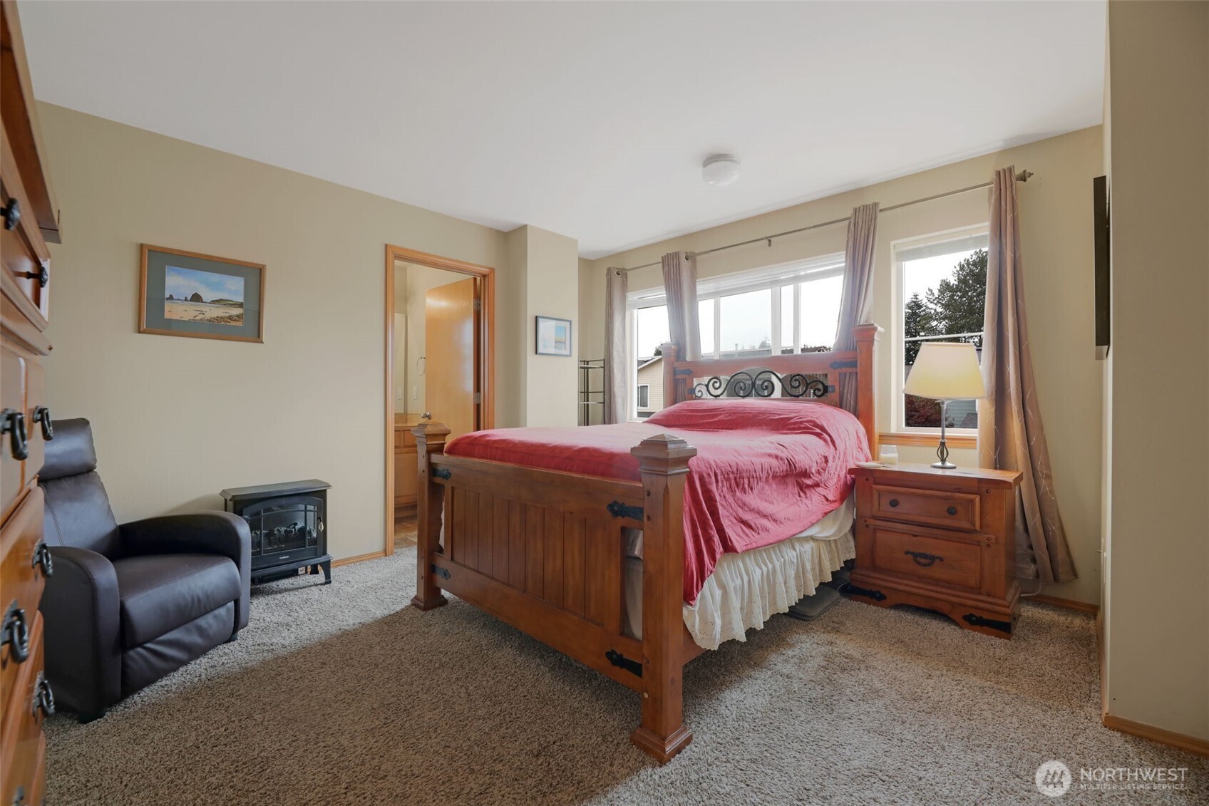17872 155th Place Southeast, Unit 2 Monroe, WA 98272 - Photo 14 of 19 a bedroom with a bed chair and window