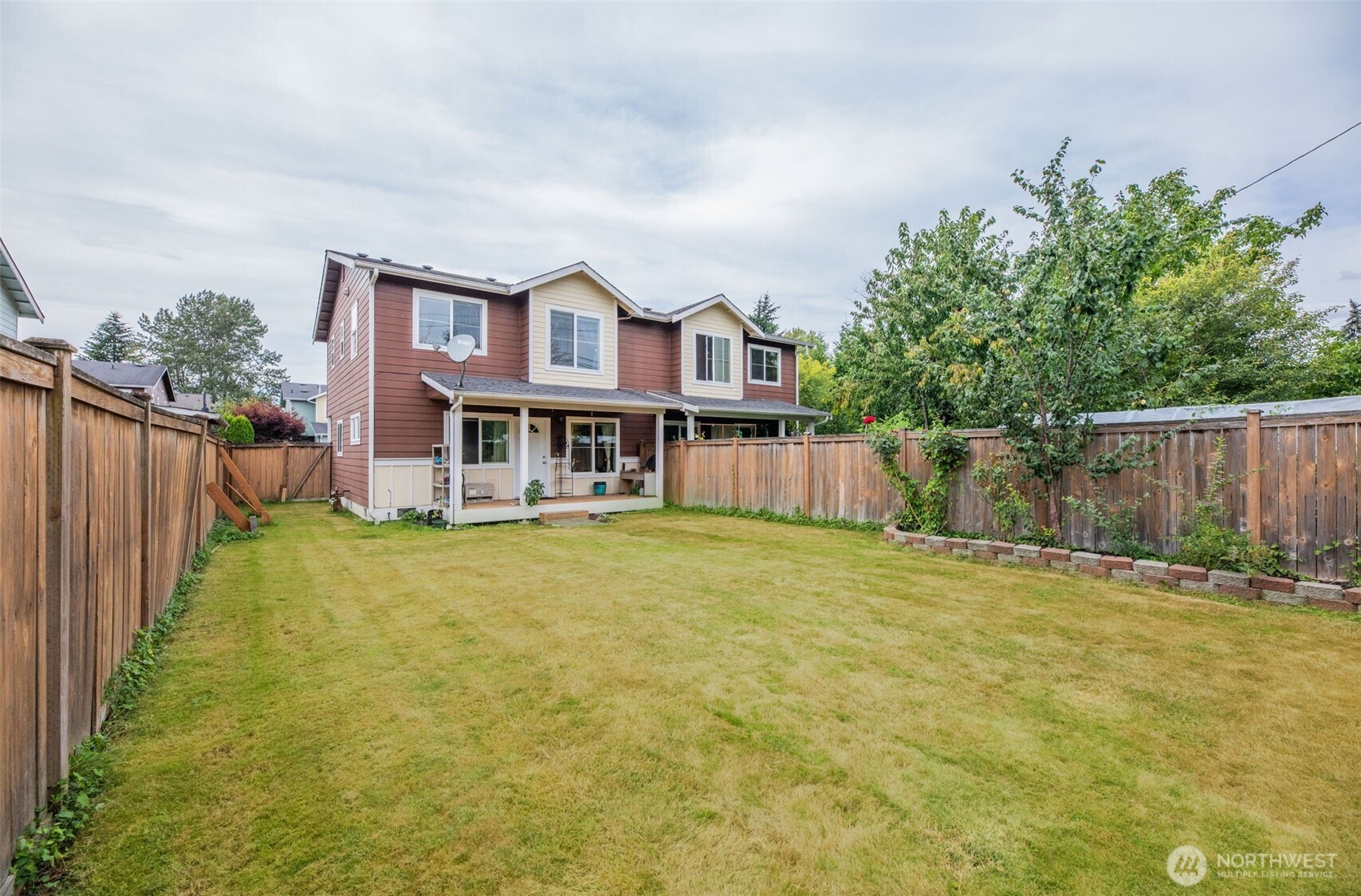 17872 155th Place Southeast, Unit 2 Monroe, WA 98272 - Photo 5 of 19 a front view of a house with a garden