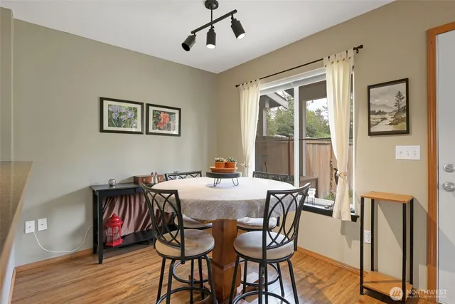 a view of a dining room with furniture window and wooden floor