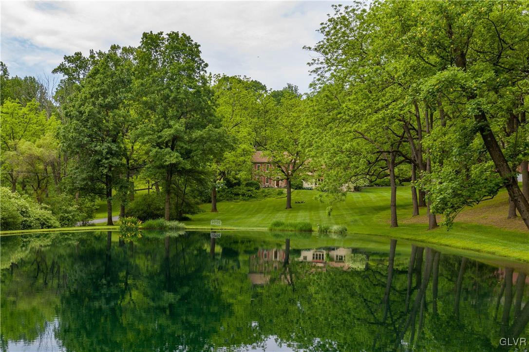 350 County Line Road East Riegelsville, PA 18077 - Photo 1 of 41 a view of a grassy field with trees