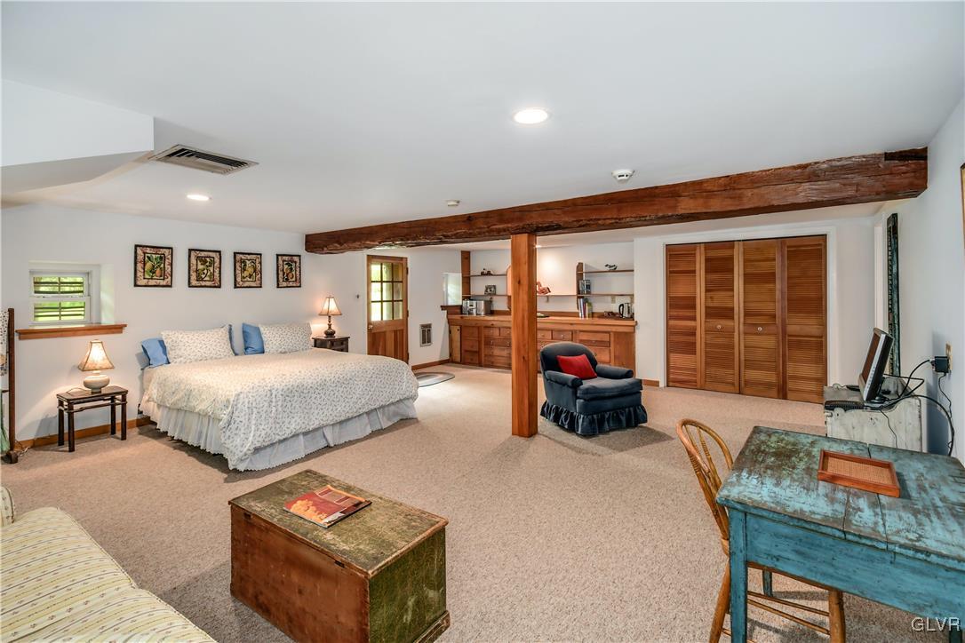 350 County Line Road East Riegelsville, PA 18077 - Photo 24 of 41 a bed room with furniture and a fireplace