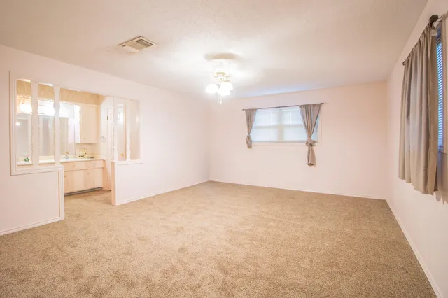 a white toilet sitting next to a shower curtain