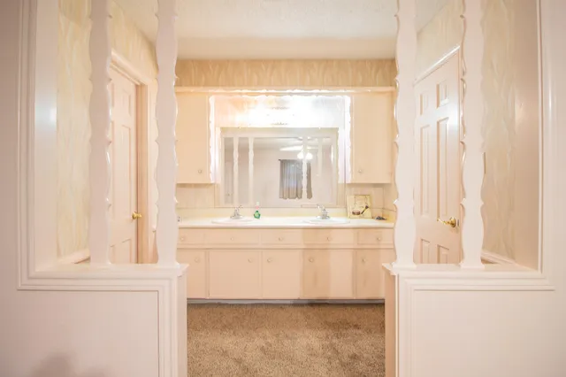 a bathroom with a glass shower door