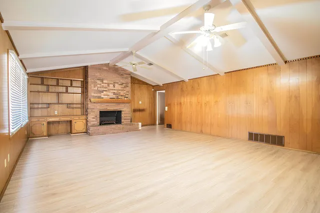 a kitchen with granite countertop a refrigerator and a sink