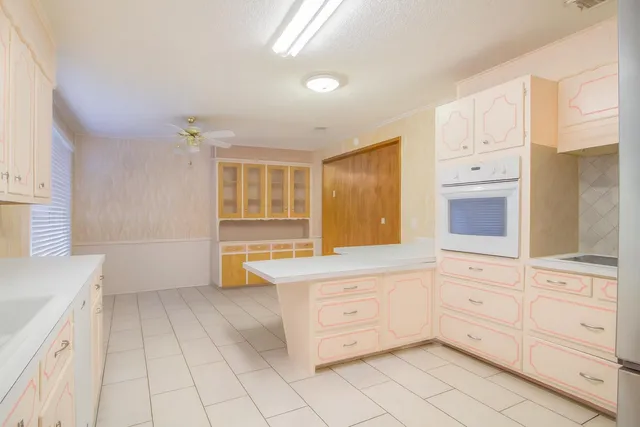 a bathroom with a bathtub a sink and a window