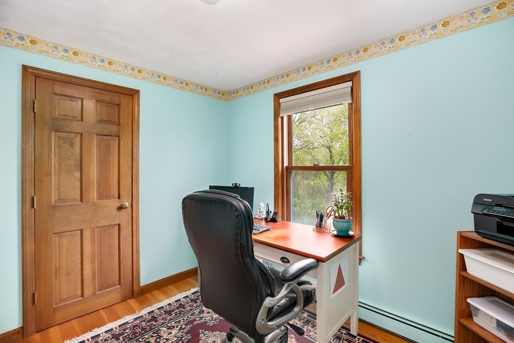 15 Barrett Road Lexington, MA 02421 - Photo 22 of 30 a view of a workspace with furniture and a window