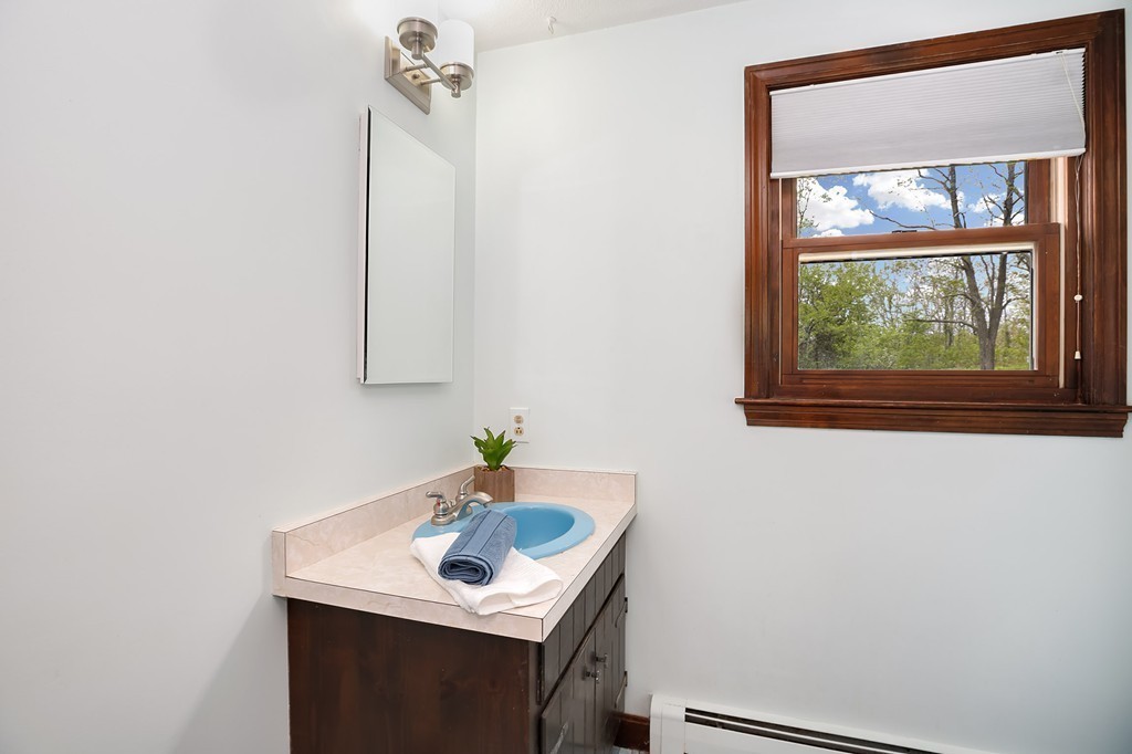 15 Barrett Road Lexington, MA 02421 - Photo 25 of 30 a bathroom with a sink and a mirror
