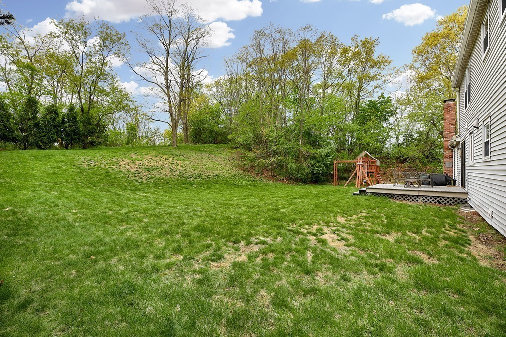15 Barrett Road Lexington, MA 02421 - Photo 26 of 30 a backyard of a house with lots of green space