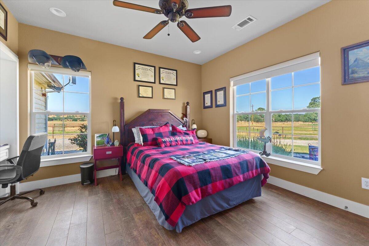 15775 Red Bank Road Red Bluff, CA 96080 - Photo 34 of 113 a bedroom with a bed and wooden floor