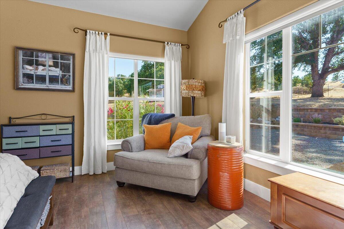 15775 Red Bank Road Red Bluff, CA 96080 - Photo 39 of 113 a living room with furniture and a floor to ceiling window