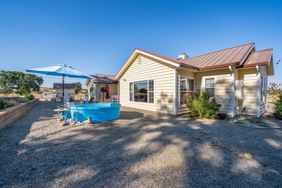15775 Red Bank Road Red Bluff, CA 96080 - Photo 66 of 113 a view of a house with backyard and porch