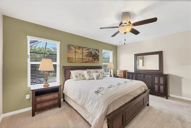 a bedroom with a bed and a tv