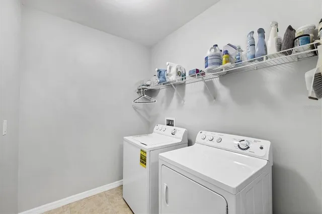 a living room filled with furniture and a floor to ceiling window
