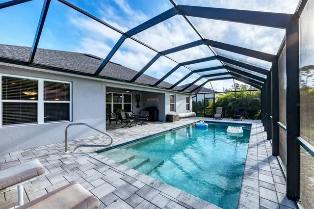 a view of swimming pool with a patio