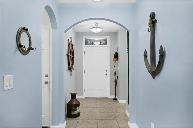 a living room with furniture and large window