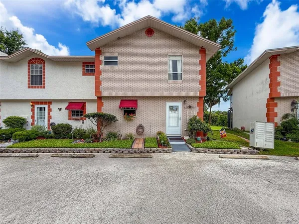 a view of house with outdoor space and street view