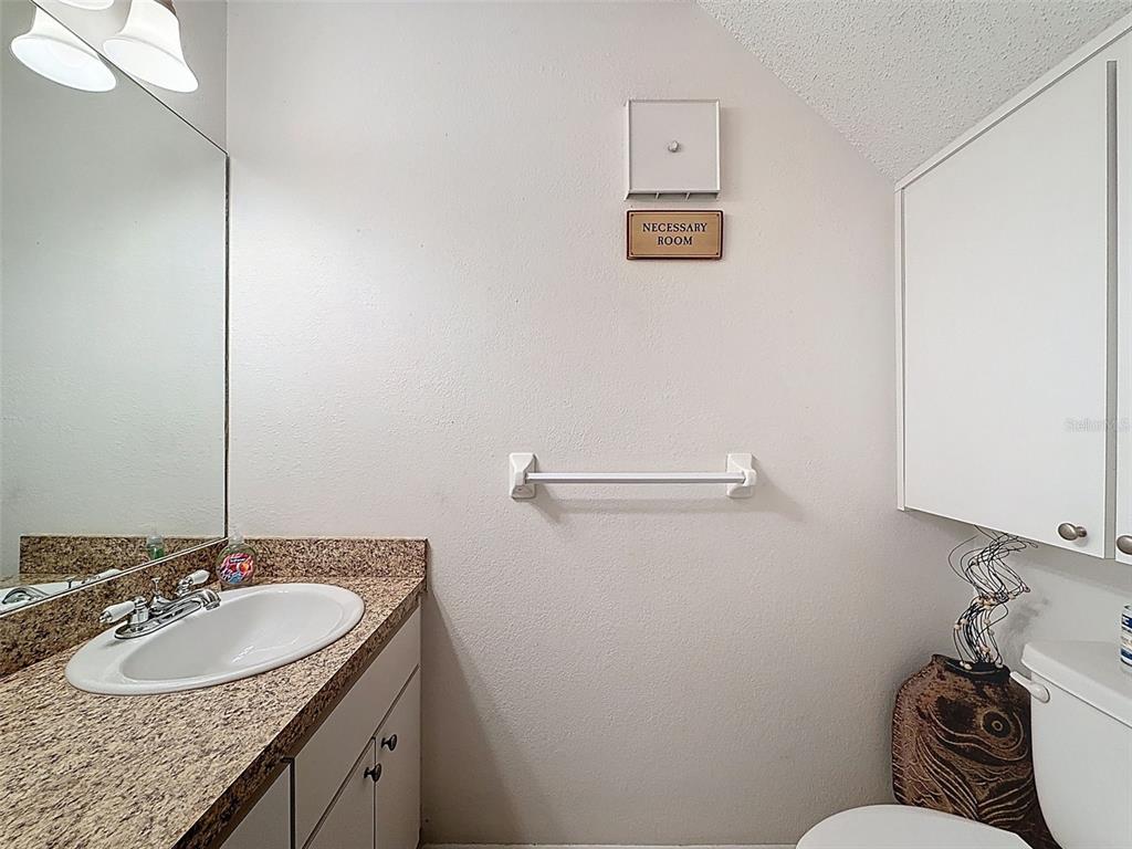 7135 Trenton Place New Port Richey, FL 34653 - Photo 18 of 50 a bathroom with a sink and a mirror