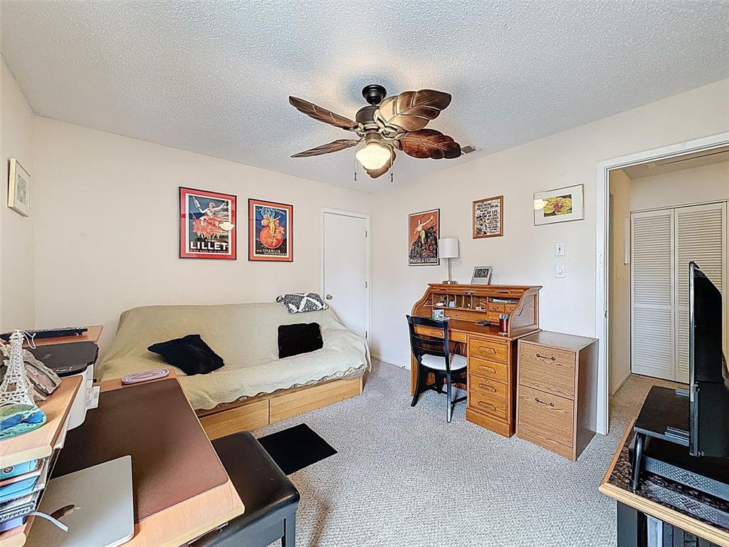 7135 Trenton Place New Port Richey, FL 34653 - Photo 23 of 50 a living room with furniture and a flat screen tv