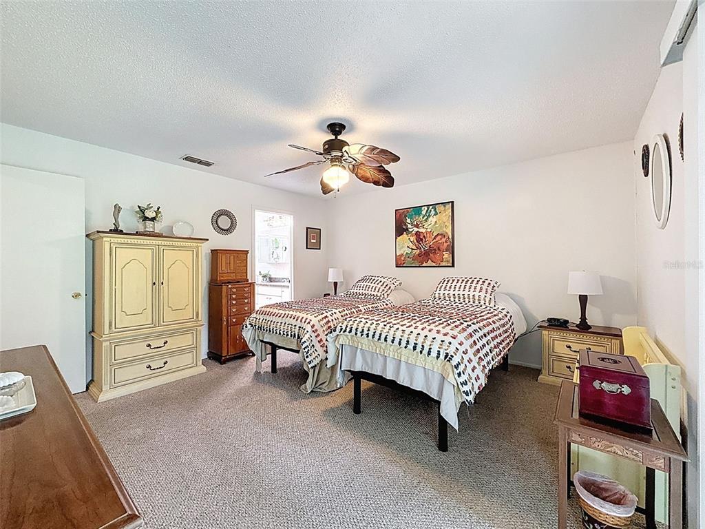 7135 Trenton Place New Port Richey, FL 34653 - Photo 26 of 50 a bedroom with a bed and a window